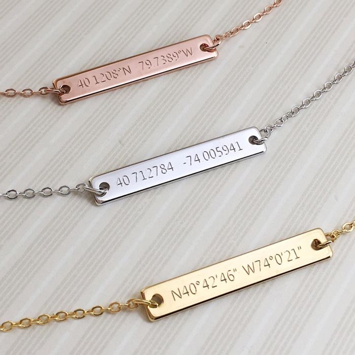 A necklace with a custom engraved plate