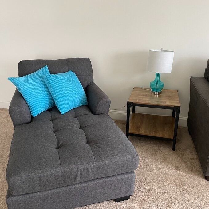 The gray chaise lounge chair sitting in a reviewer's room