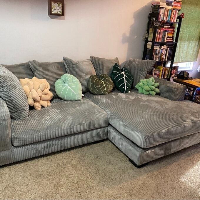 A reviewer’s cozy gray sectional, beautifully accented with colorful throw pillows.