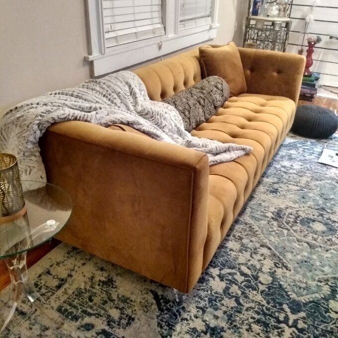 A reviewer’s image showcasing the tan couch.