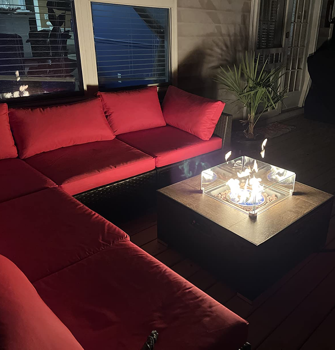 another reviewer's nighttime patio arrangement with a red sectional sofa and a glowing fire pit table