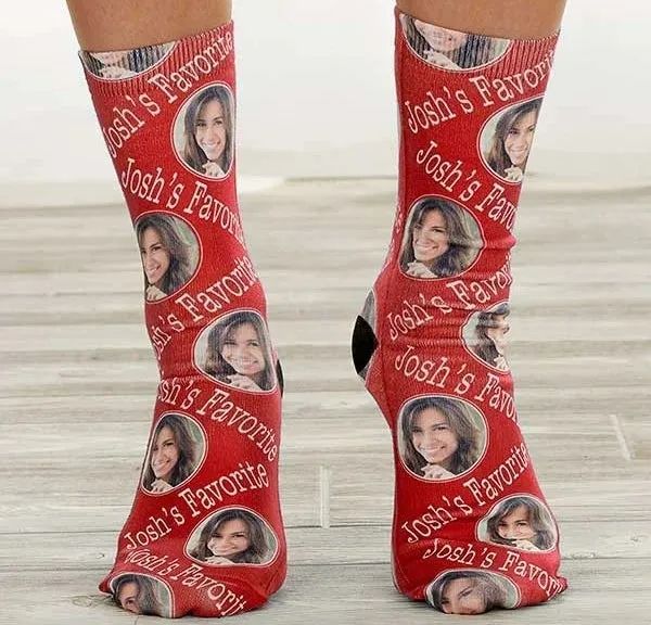 A close-up of the red socks being worn by a model.