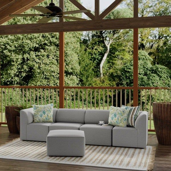 Outdoor sectional sofa paired with a matching ottoman on a deck, available in fresh gray