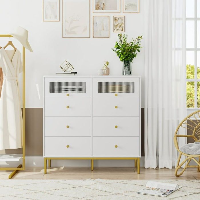 Six-drawer white dresser with gold accents and two compartments with transparent windows