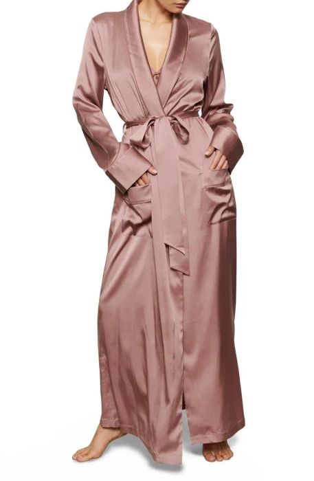 Model showcasing a rose-colored silk robe.