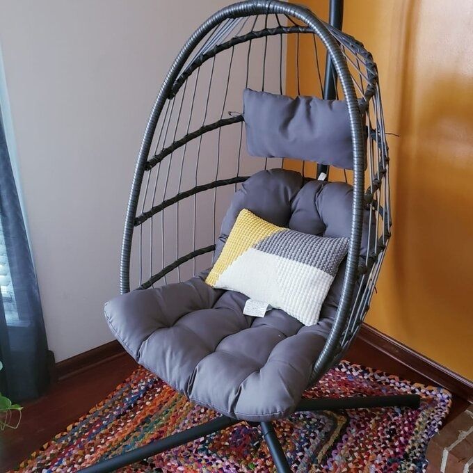 A beautifully styled porch swing in a reviewer’s home, creating the perfect spot to unwind.