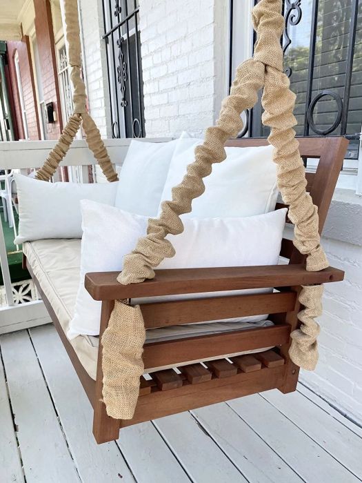 A close-up shot of the same reviewer's beautiful wooden swing.