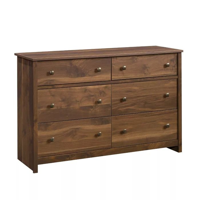 Six-drawer dark walnut dresser against a white backdrop
