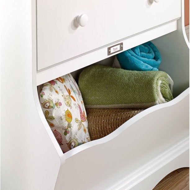 Close-up view of the cubby, neatly filled with towels