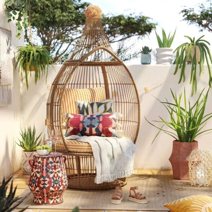 The garden stool is displayed in a lush outdoor setting.