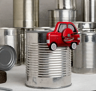 A gif showing a car can opener in action, smoothly opening a can