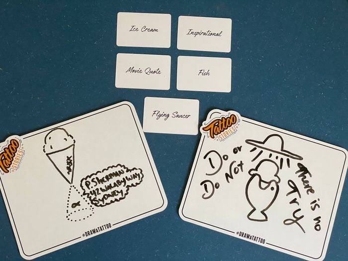Five selected cards and two boards featuring drawings of the selected cards