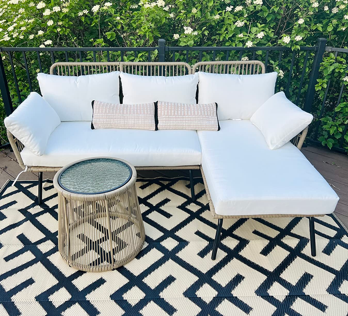 a reviewer's white sofa chaise sectional paired with a petite side table