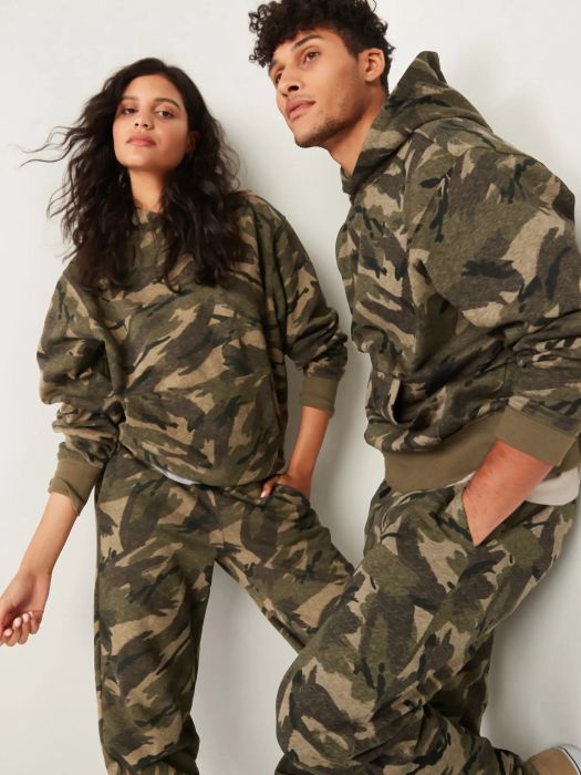 Models sporting coordinating camouflage sweatpants and hoodies
