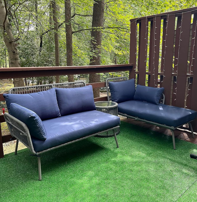 another reviewer's navy sofa chaise sectional with a small side table placed between the two sections