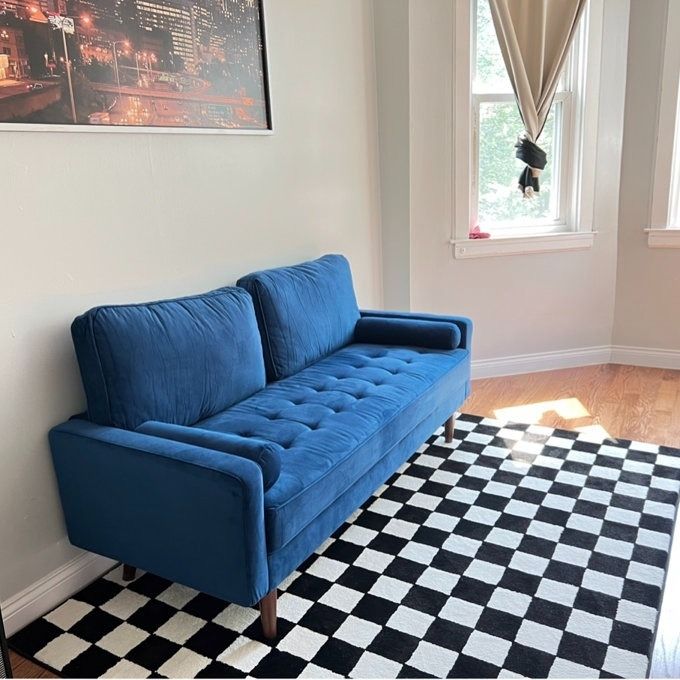 A stunning rolled-arm loveseat, the perfect blend of elegance and comfort.