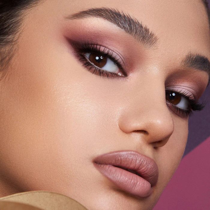 A model rocking the eyeshadows from the retro palette, highlighting its stunning and vibrant shades.