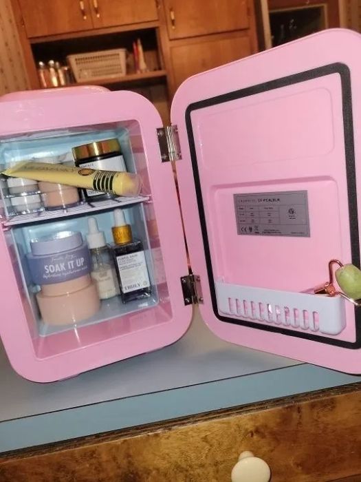A reviewer photo featuring their pink mini fridge
