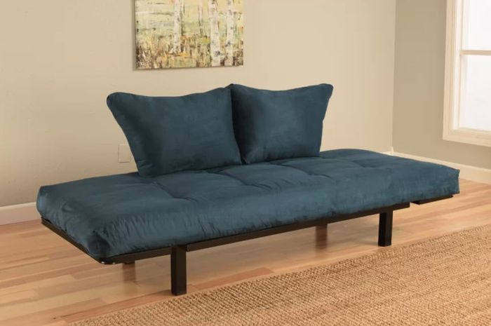 A flat futon sofa with two cushions, mounted on a metal base.