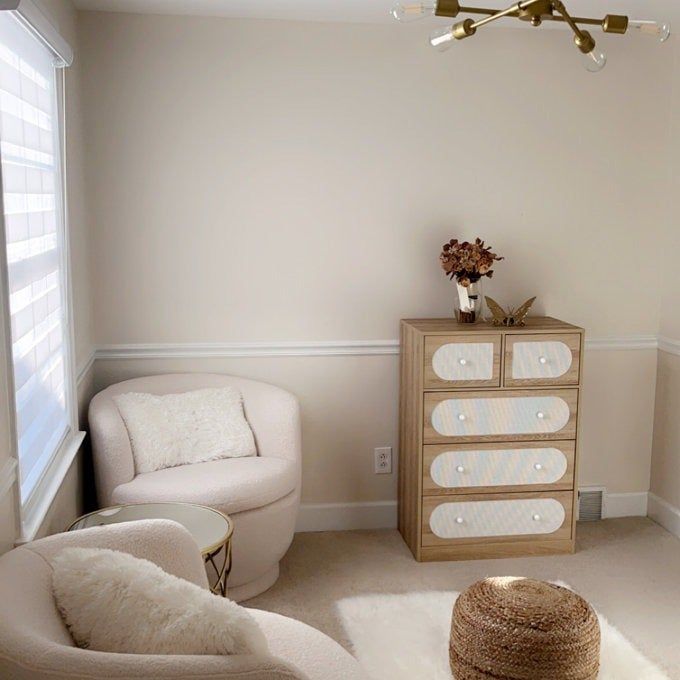 The dresser placed in a room with beige-toned furniture