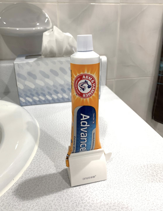 a photo of toothpaste neatly placed in the holder by the reviewer