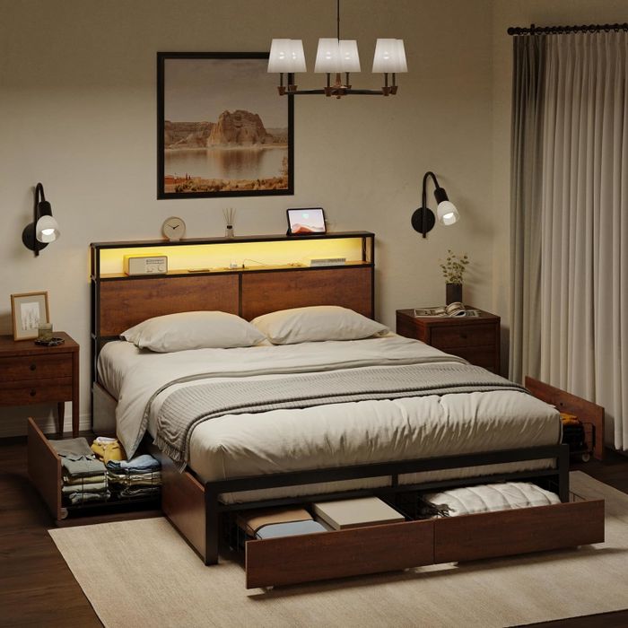 A contemporary bedroom featuring a tidy bed, nightstands, and a convenient pull-out bed drawer.