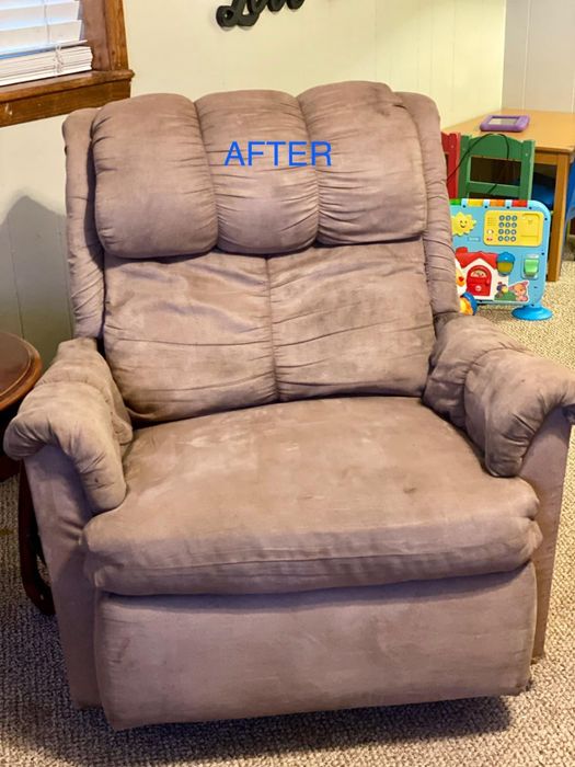 The same recliner, now spotless with all stains removed and the fabric restored to a fresh, clean appearance