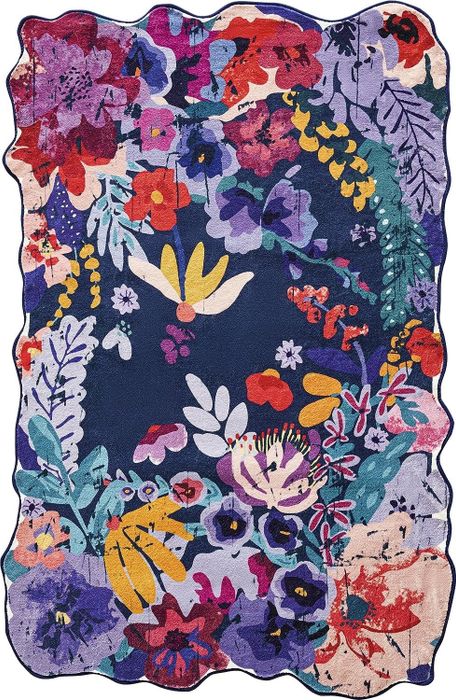 The colorful blue floral area rug.