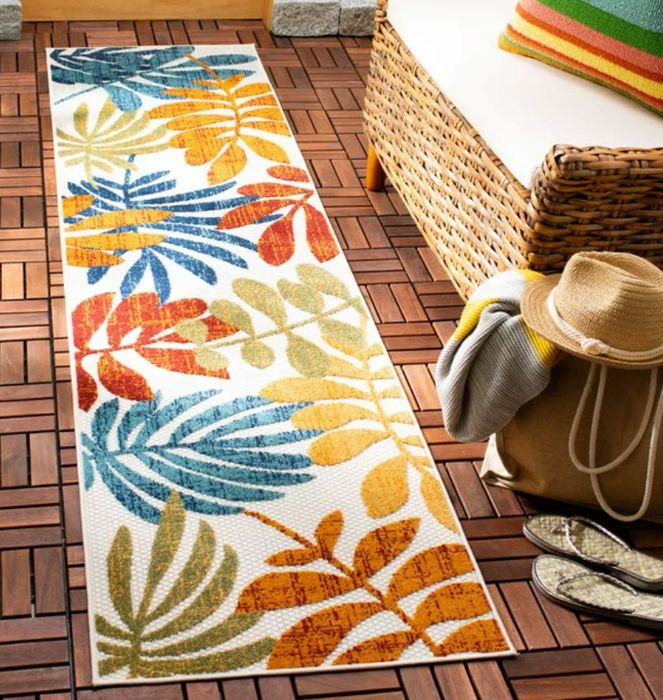 A colorful leaf-patterned runner rug.