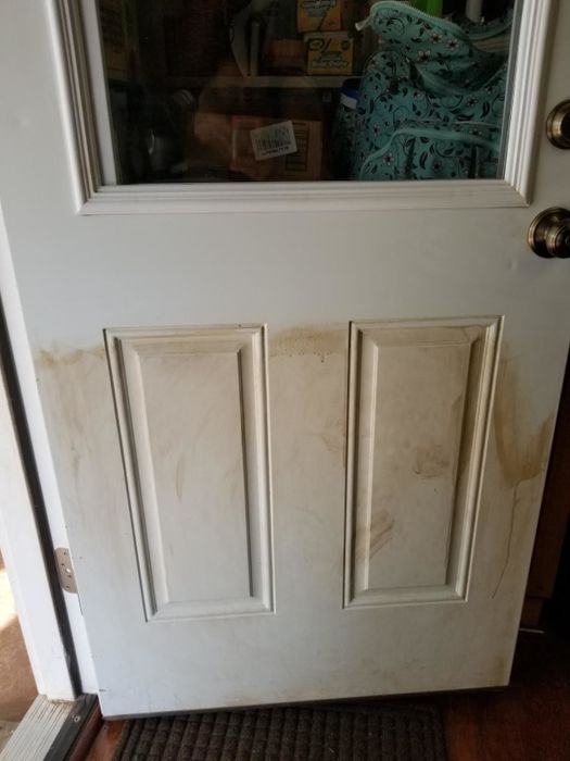A before image showing a reviewer's dirty door.