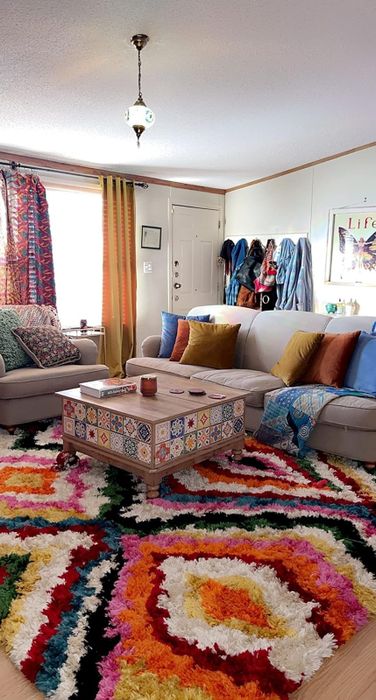 A reviewer’s image of the rug in a stylish living room setting.