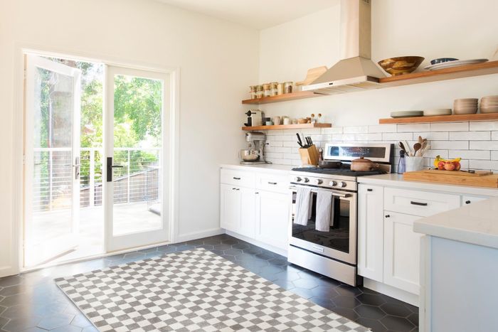 The checkered area rug placed in a stylish kitchen setting.