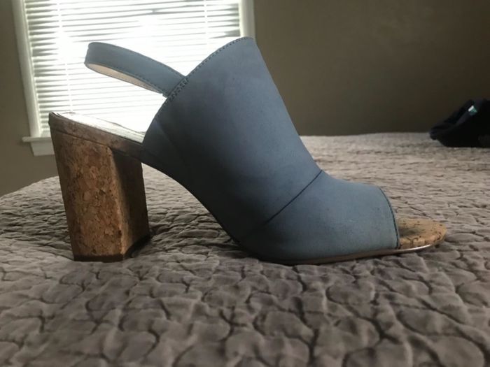 The same sandals, now spotless with no water stain after using the brush