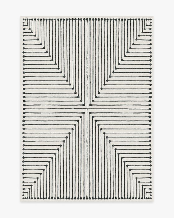 The ink spot rug, with its bold design, creating a statement piece in any room.