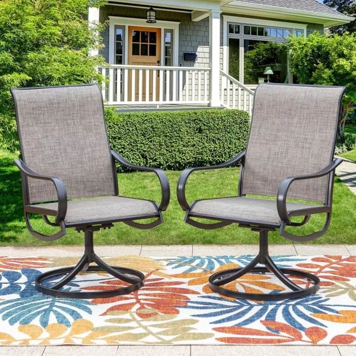 A set of gray and black patio swivel rocking chairs resting on a vibrant outdoor rug.