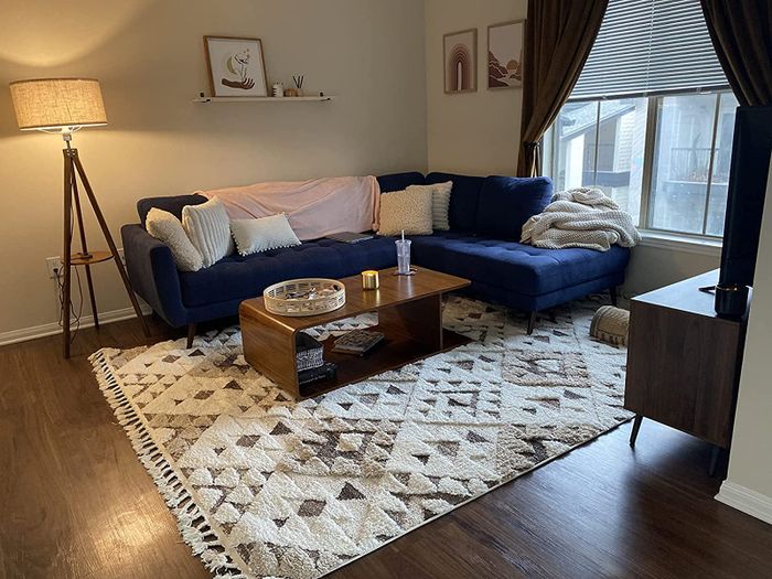 Photo of the ivory and brown rug placed in a living room