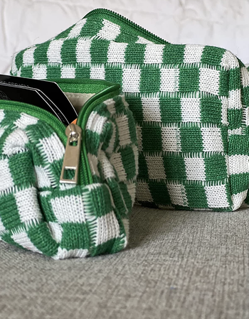 Two small zippered checkered bags in white and green.