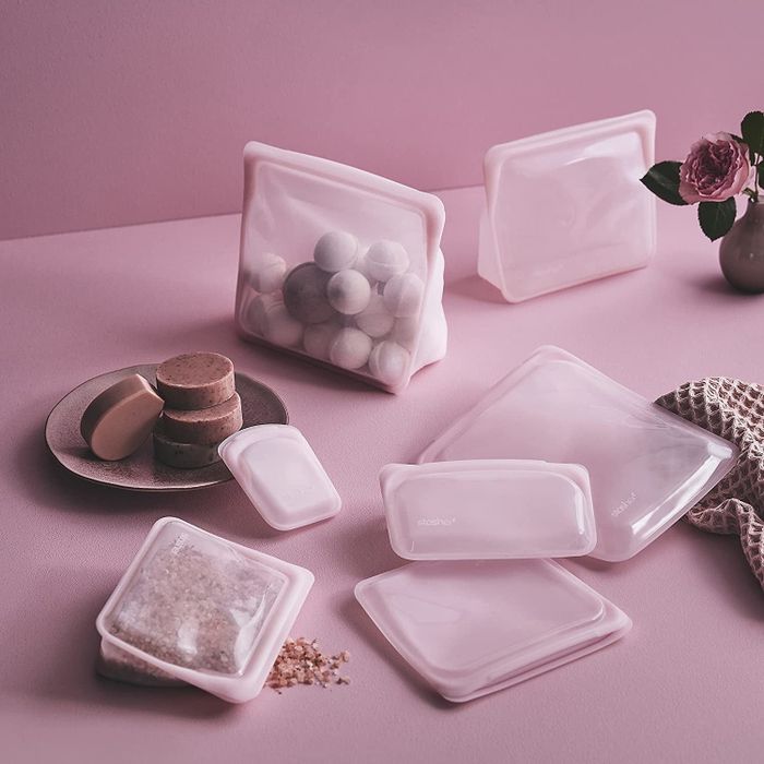 An assortment of Stasher bags in soft pink, showcasing their range of sizes for all your storage needs.