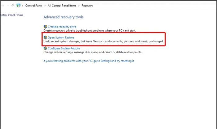 Nhấn vào Open System Restore