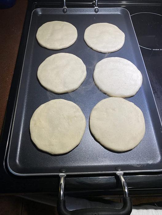 Reviewer cooking pancakes on the griddle
