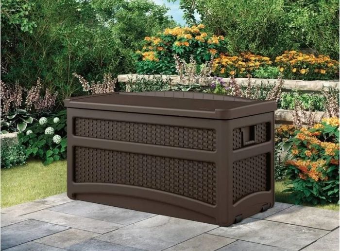 The closed deck box placed on a patio.