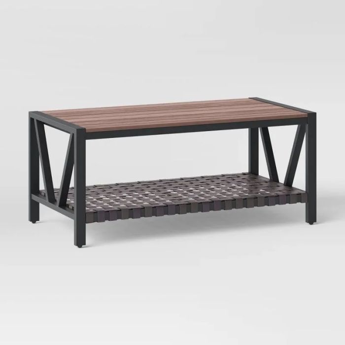 The coffee table, featuring a slatted design and metal frame, adding character to the space.