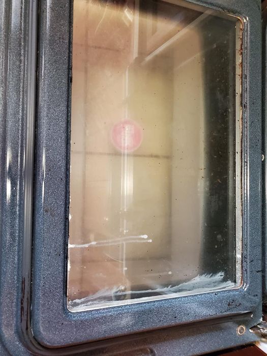 The same oven door now looking spotless and gleaming