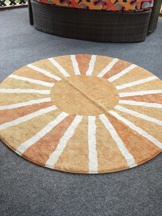 A reviewer’s image of the 4-foot round sun rug.
