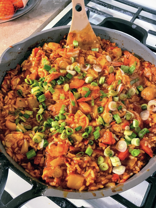 A dish of rice and vegetables fills the Always Pan.