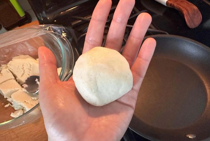 Arepa dough formed into a ball.