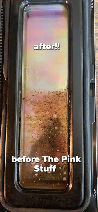 A reviewer’s oven door, half covered in grime, the other half looking brand new after using The Pink Stuff