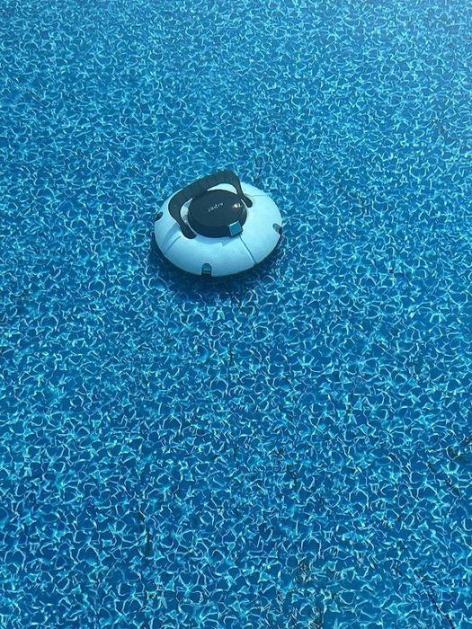 A reviewer's photo of the robotic pool cleaner in action in a pool
