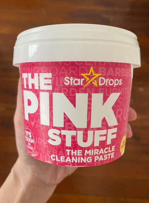 Britt holding a tub of The Pink Stuff