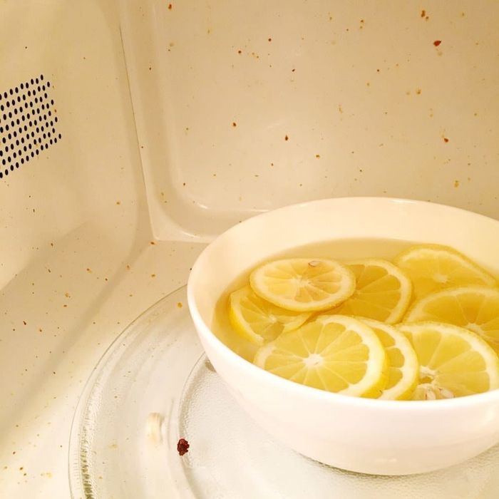 a bowl of lemons in water inside my messy microwave